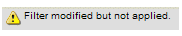 The dialog has a yellow triangle with a black exclamation mark. It displays a Filter modified but not applied message.